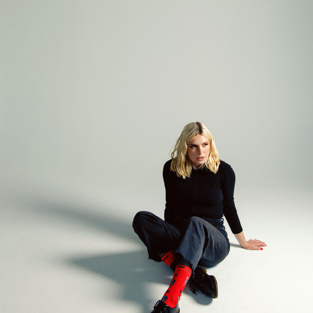 Q.E. sitting on floor looking away from camera